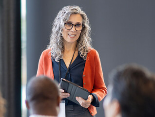 Person presenting at conference