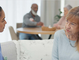 nurse talks to senior