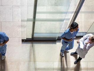 aerial view of doctors and nurses entering a hospital