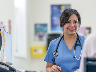 nurse talks to patient