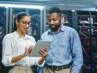 IT specialists collaborate in data center
