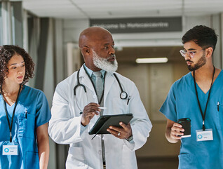 Doctor and nurses talking