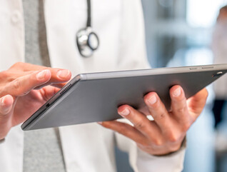 Doctor using tablet