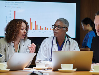 clinicians and IT team meeting