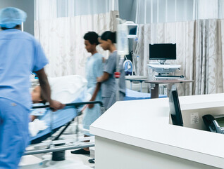 Nurses pushing hospital gurney