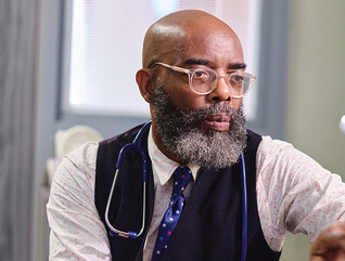 Physician working on a computer