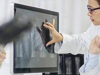 doctors looking at images on a screen