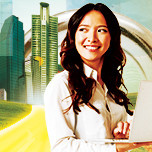 pic of woman with laptop in front of futuristic city