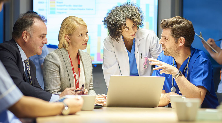 hospital management listening to doctor