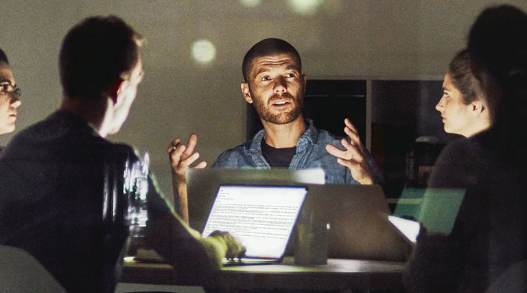 Shot of creative employees working late in the office