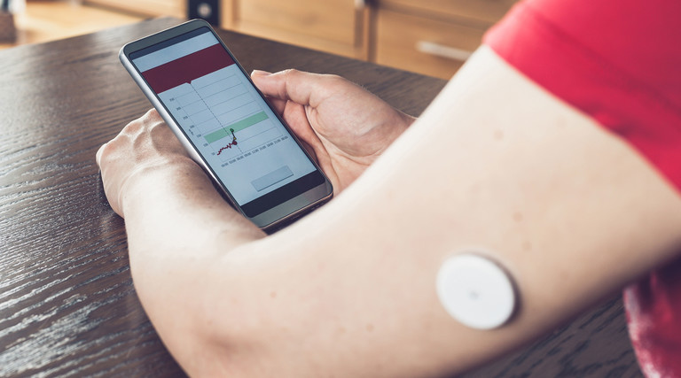 Woman monitors glucose levels