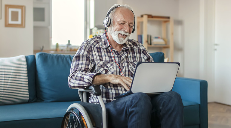 older adult with tablet computer