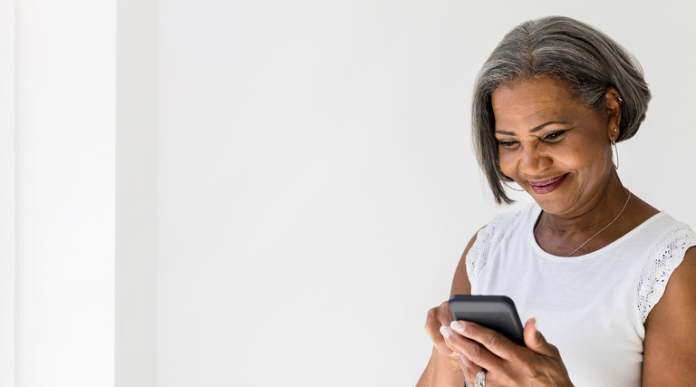 Senior uses smartphone