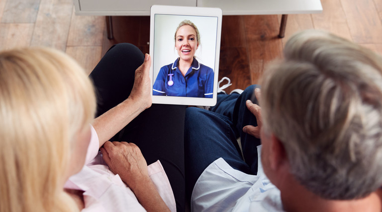 Doctor talks with patients
