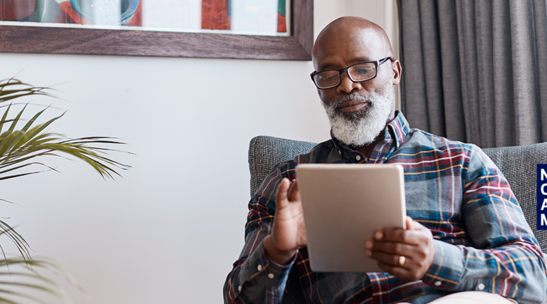 Senior in home with tablet