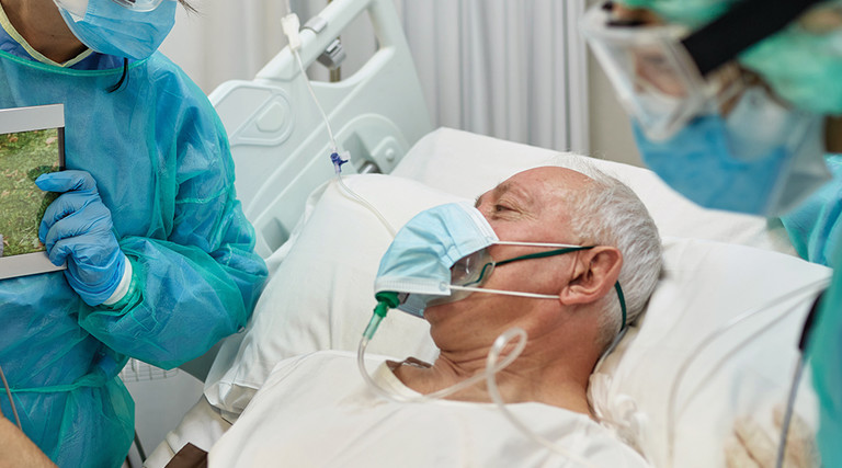 Senior COVID-19 Patient on Video Call with Granddaughter