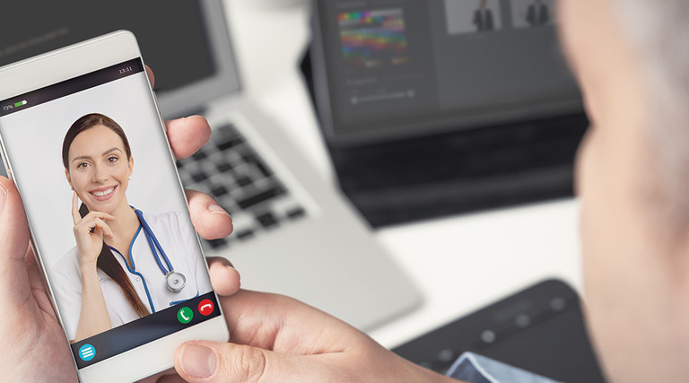 Man on video call with doctor.