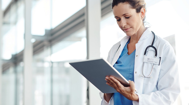 Female doctor using a digital tablet.