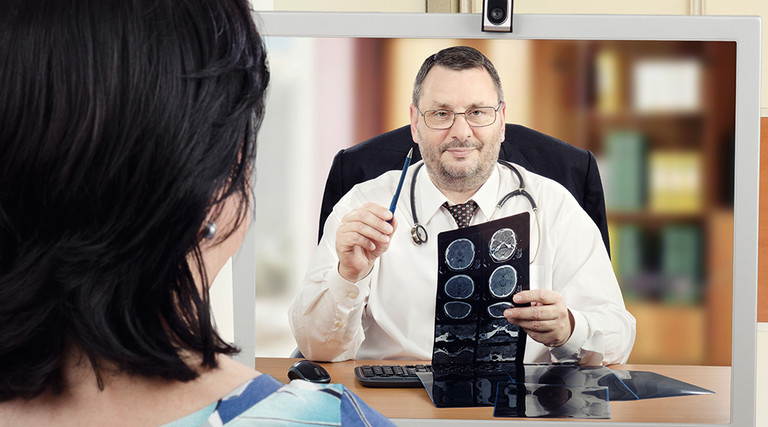 woman attends telehealth appointment with cardiologist