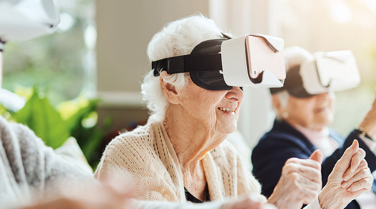 seniors smile while using virtual reality 