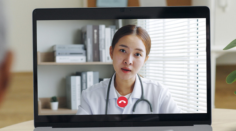 Doctor talking with patient virtually