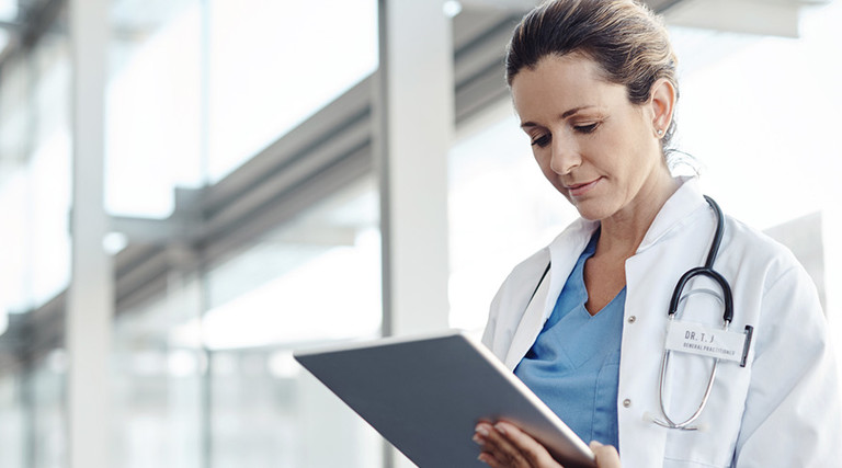 Doctor using a digital tablet