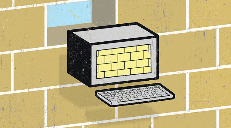 computer "brick" in front of brick wall concept