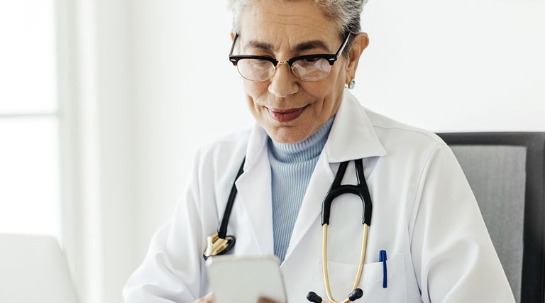 Doctor using mobile devices