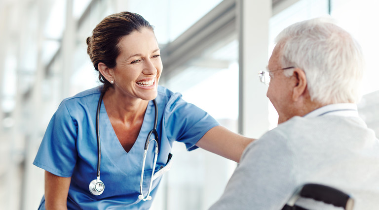Nurse helping an elderly patient