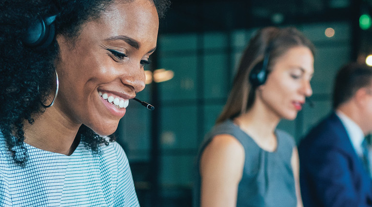 Female wearing headphones working in office