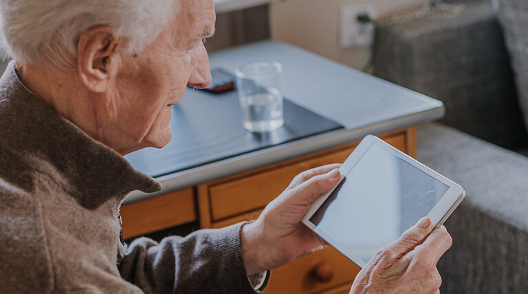 Senior using Digital Tablet