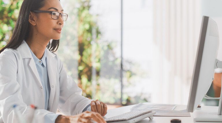 doctor on computer monitor in office