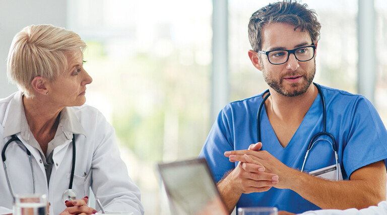 Healthcare team discussing at a table