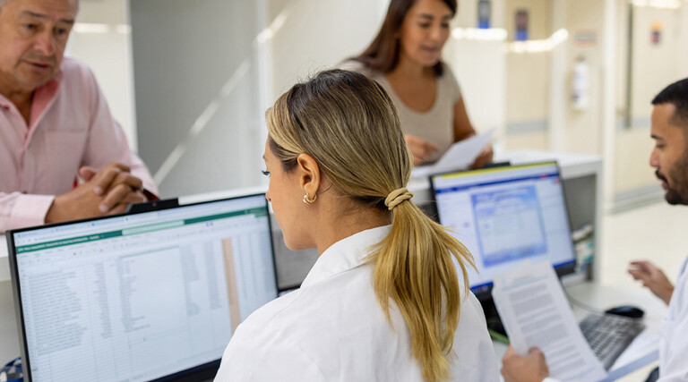 Doctors using computers at a hospital