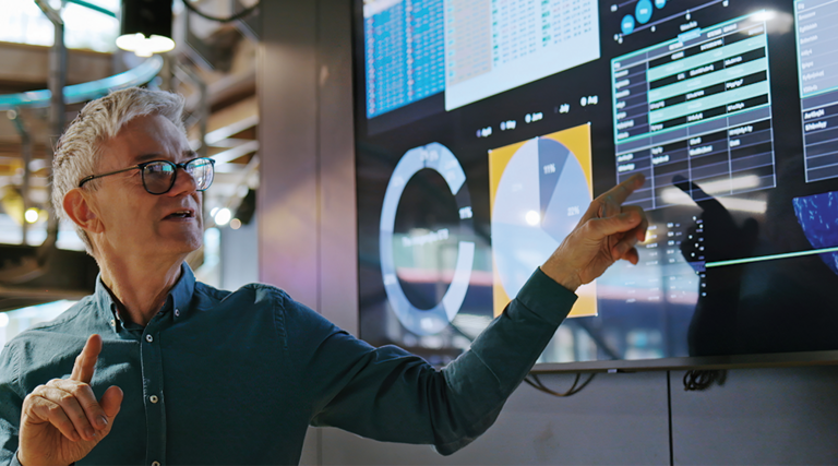 scientist explains data on big screen