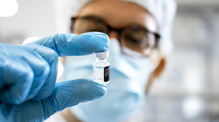 Pharmaceutical worker reviewing vaccine