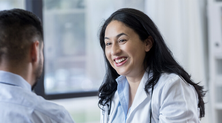 Doctor conversing with patient