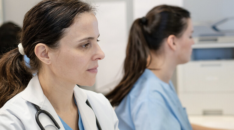 Doctors using computers in a hospital