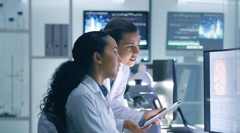 Doctors reviewing information on devices