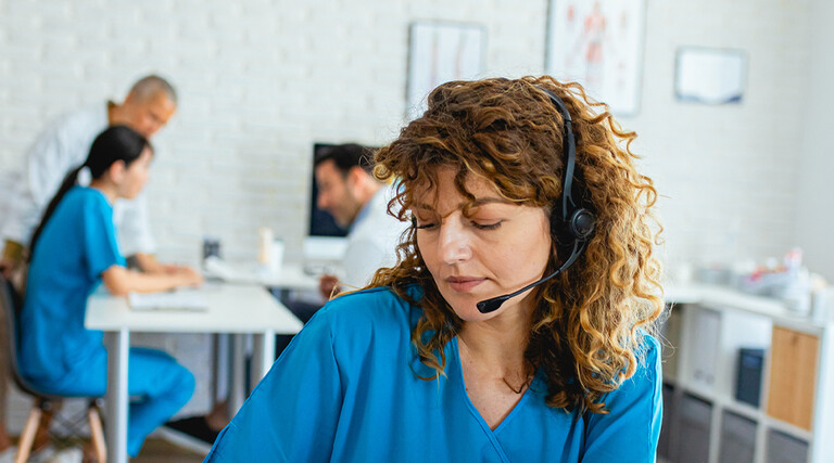 Nurse speaking to patient via phone