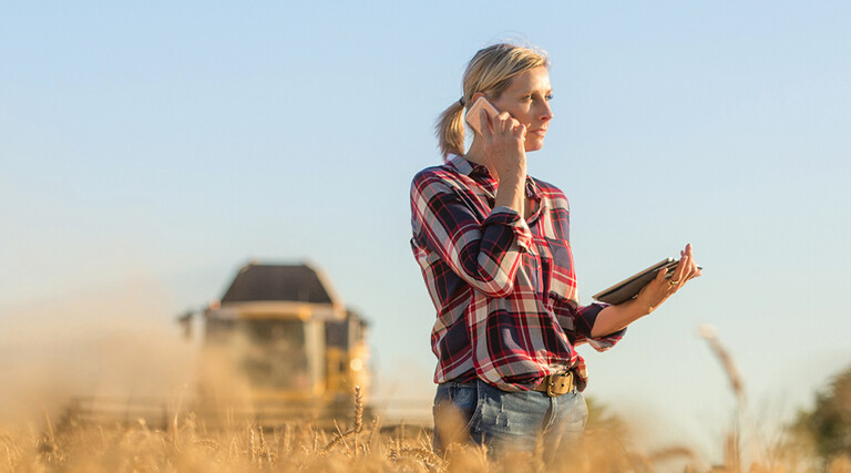 Person in rural setting talking on phone