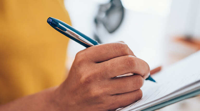 Person with a clipboard checking a list