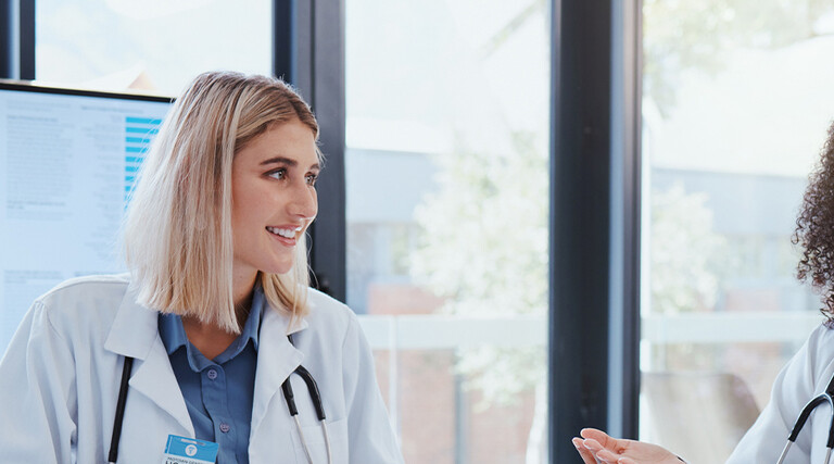 Doctors discussing data in a meeting