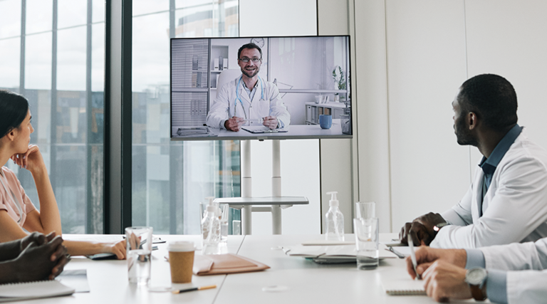 care team speaks with physician over conference call