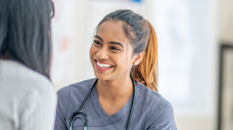 nurse smiling at patient