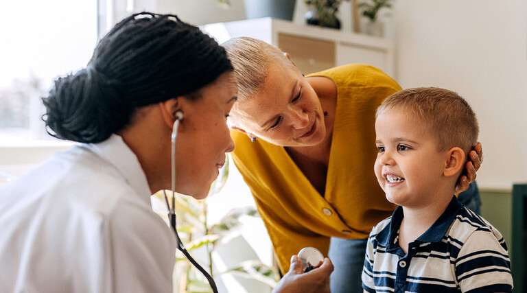 Pediatrician working with patient