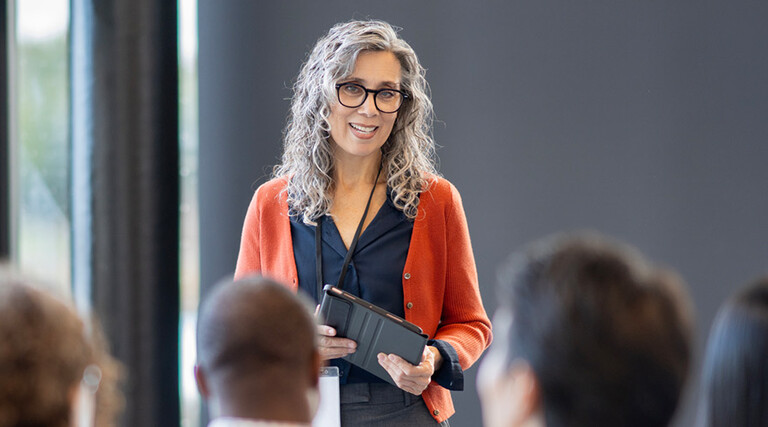 Person presenting at conference