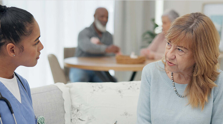 nurse talks to senior