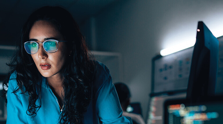 cybersecurity expert surrounded by code