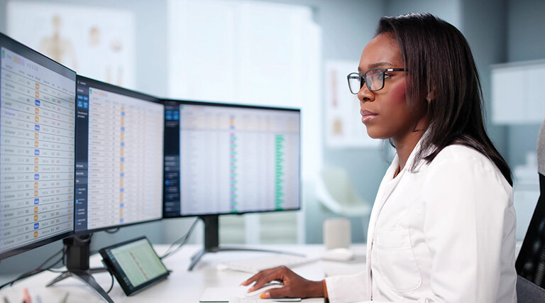 doctor on computer deals with healthcare billing